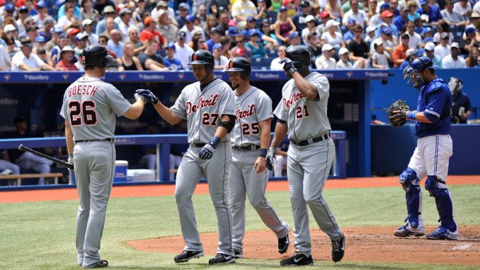 Detroit Tigers shortstop Jhonny Peralta (centre) celebrates his three-run home run with his teammates Brennan Boesch, Ryan Raburn and Delmon Young in the second inning. That was all the offence the Tigers would need as the visitors avoided a three-game sweep with a 4-1 win over the Toronto Blue Jays at Rogers Centre (John Lucero)
